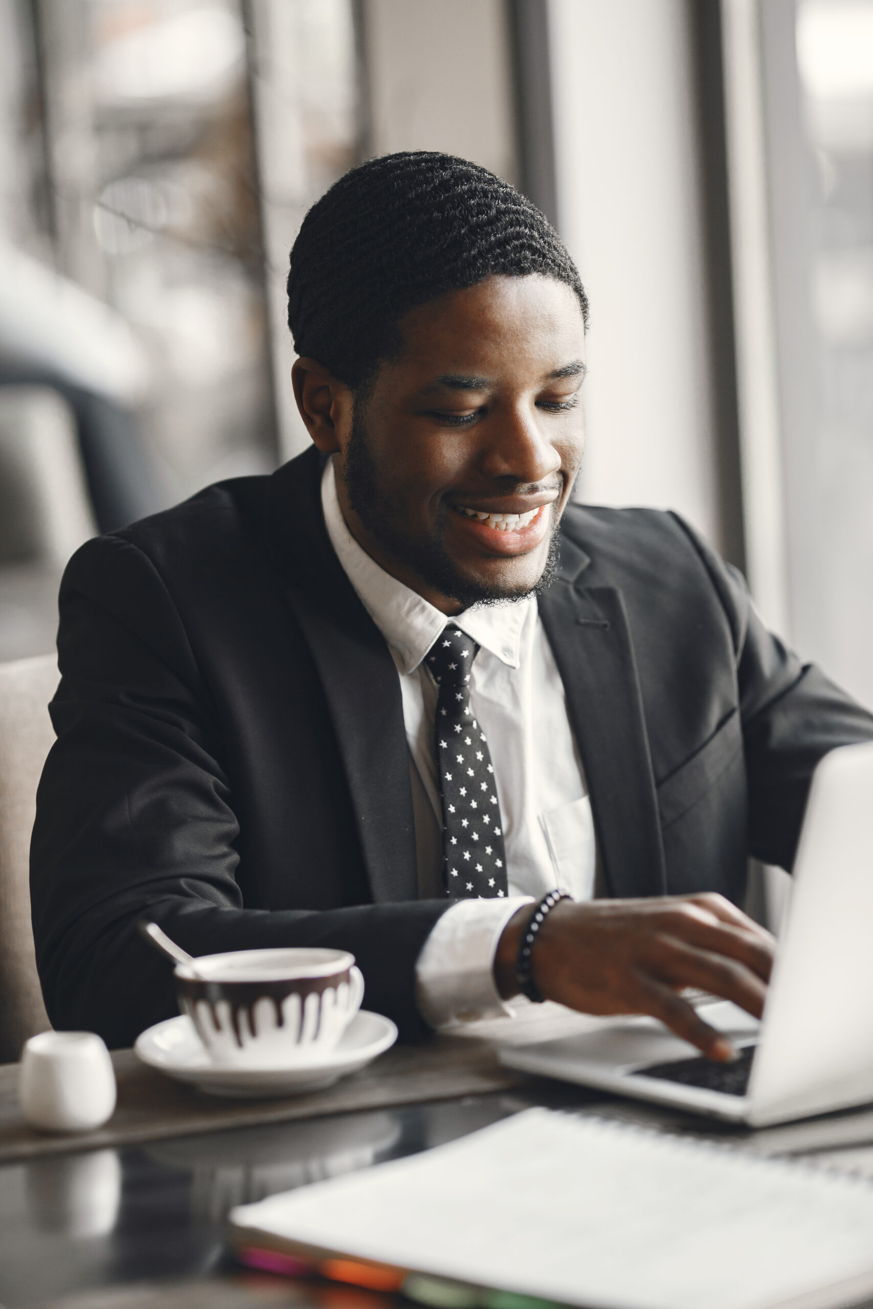 Man drinks coffe. Businessman reads documents. Guy with laptop.